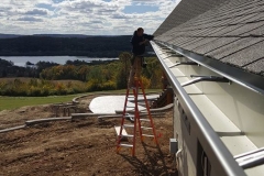 Gutter work with lake background